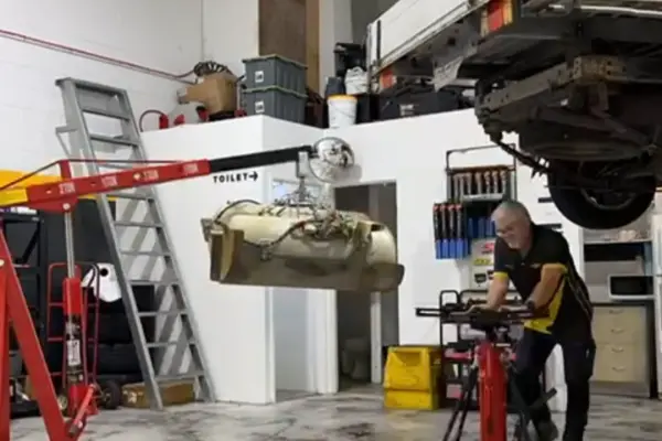 Mechanic inspecting an LPG car tank