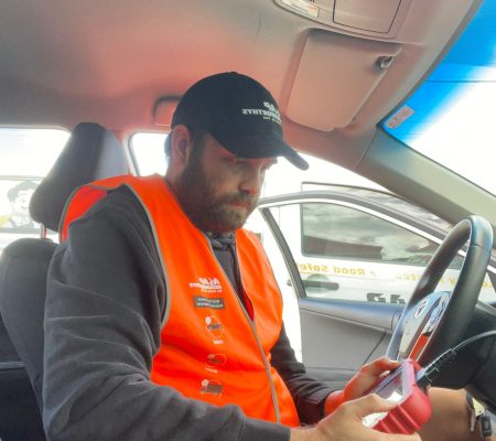 queensland car examiners carrying out a computer diagnosis to ensure the computer of the vehicle is working well.
